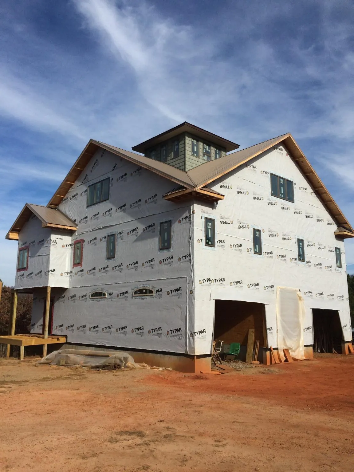 New two story house under construction with a cupola and gabled roofs in Aberdeen